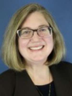 Headshot of Dr. Moran in black blazer