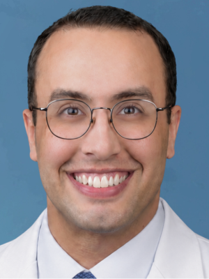 Man smiling in white coat
