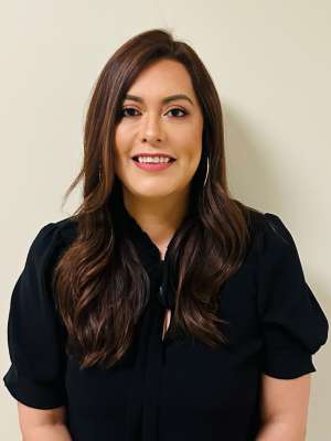 headshot of Maria Ventura in black blouse