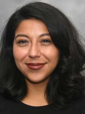 Headshot of Bianca, who has dark hair