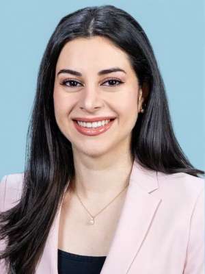 Head shot of Natalie Nabaty in business attire, smiling at the camera