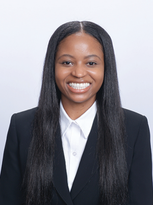 Head shot of Christina Ramsey in business attire, smiling at camera