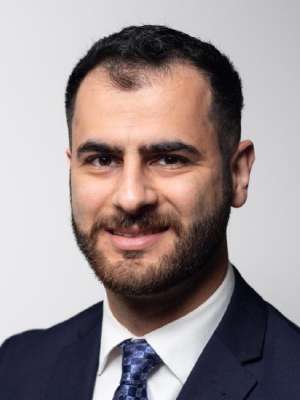 headshot of Matt Mekany in dark blue suit