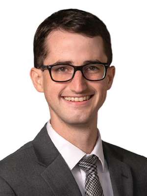 headshot of Dr. Michael Raddatz in gray suit