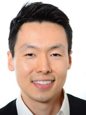 headshot of Dr. Alexander Sun in black suit
