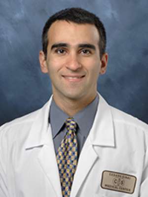 Headshot of Mark Goodarzi in white lab coat