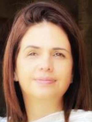 Person with shoulder-length brown hair, face obscured, wearing white top