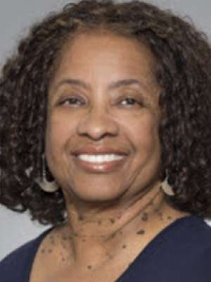 headshot of Aziz Lucas-Wright in dark blue blouse