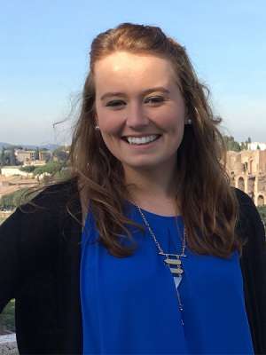 Layna Elder outside with a cityscape in the background