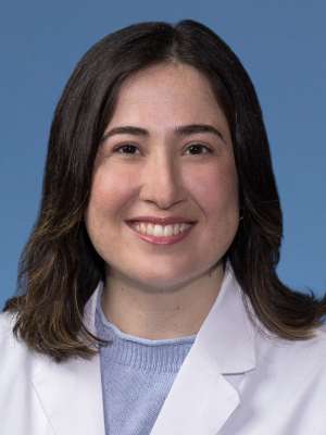 Zeliha Celen Simsek, MD in a white lab coat