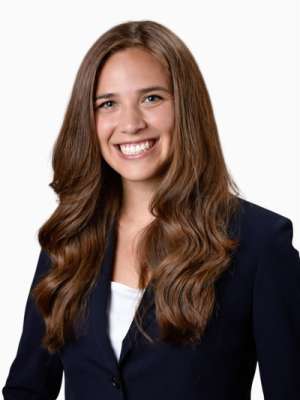 Jacqueline Pinon smiling professional headshot in a dark blazer