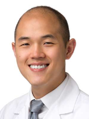 headshot of Dr. Michael Oh in white coat
