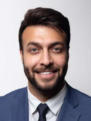 headshot of Miad Hadaegh in blue suit