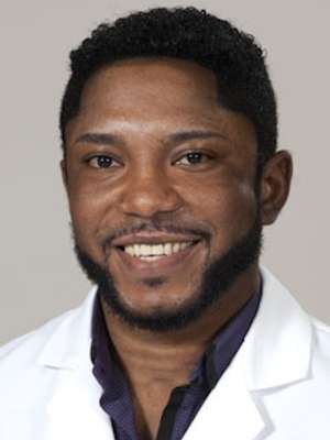 Portrait of person in white coat