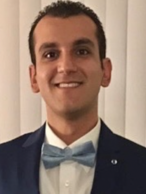 headshot of Dr. Samer Alkalis in suit and bow-tie