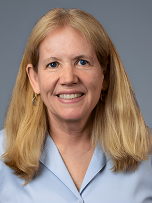 Laurie Goodyear headshot wearing a light blue lab coat.