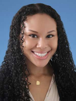 Michelle Colbert, MD in a white lab coat