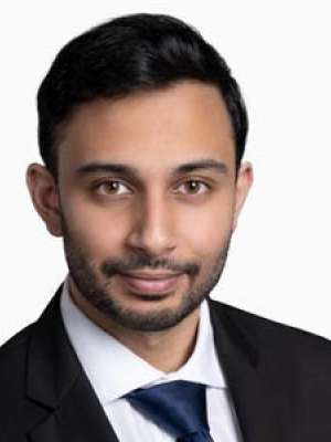 Khan Abdulhaseeb, professional headshot of a man in a suit and tie