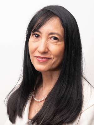 headshot of Dr. Quynh Pham in white blazer