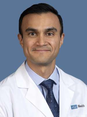 Michael C. Garcia, MD, professional headshot in white coat and tie.