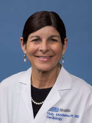 Holly R. Middlekauff, MD headshot wearing white lab coat and pearl earrings