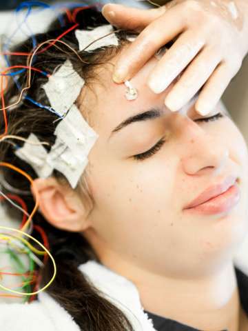 Young woman having an EEG test