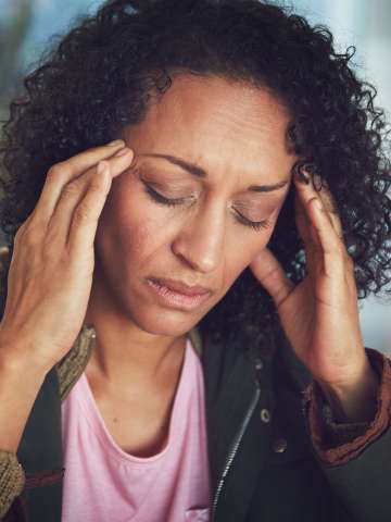 Mature woman experiencing a headache