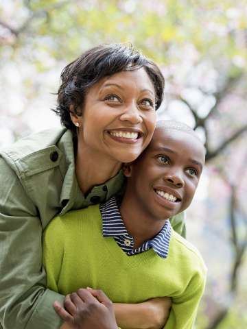 Mother hugging son