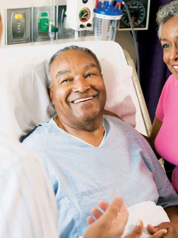 Older Patient with Doctor and Wife