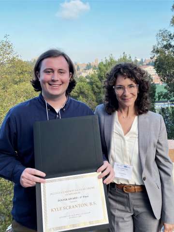 Kyle Scranton holding his first place certificate with Michela Ottolia, Ph.D