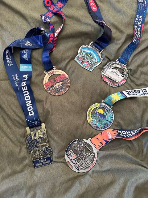 5 medals laid out next to each other