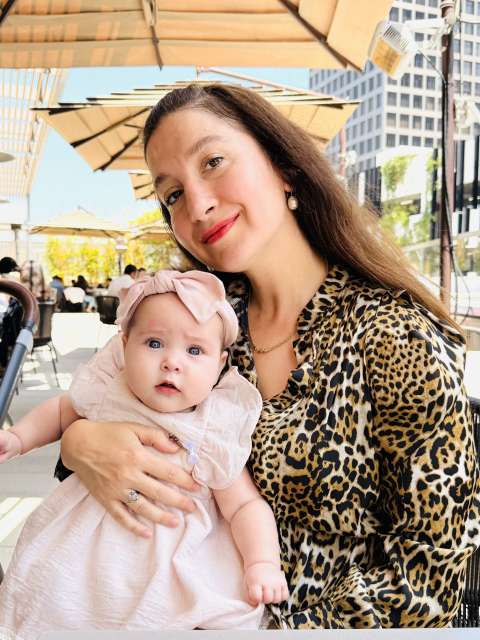 A new mom holds her baby.