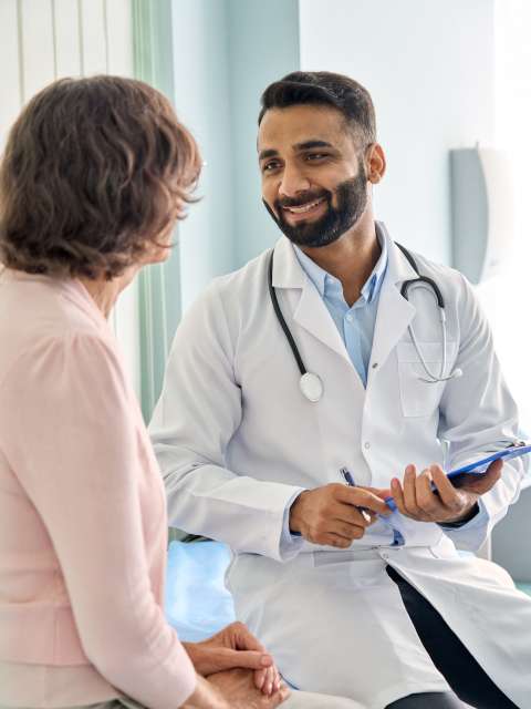 Doctor consulting with cancer patient