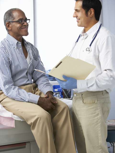 Doctor consulting with cancer patient