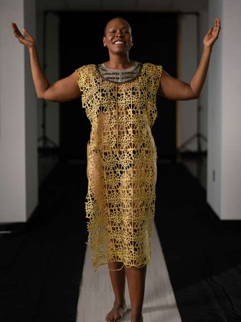 Melissa Watkins wears a beaded gold dress to represent acceptance. (Photo by Nick Carranza)