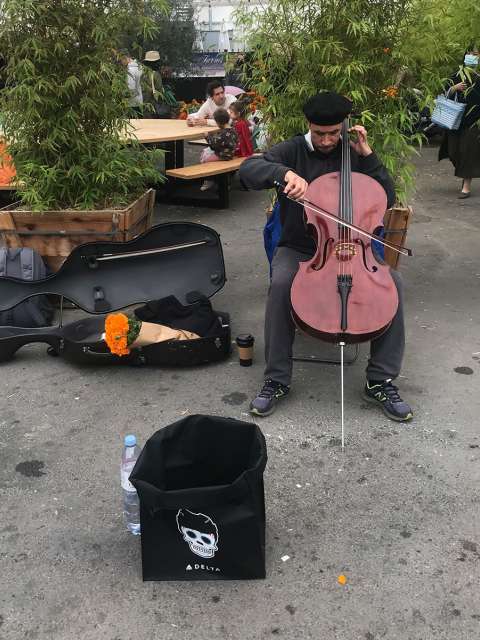 Jernej Copic plays his cello at the Atwater Village Farmers’ Market.