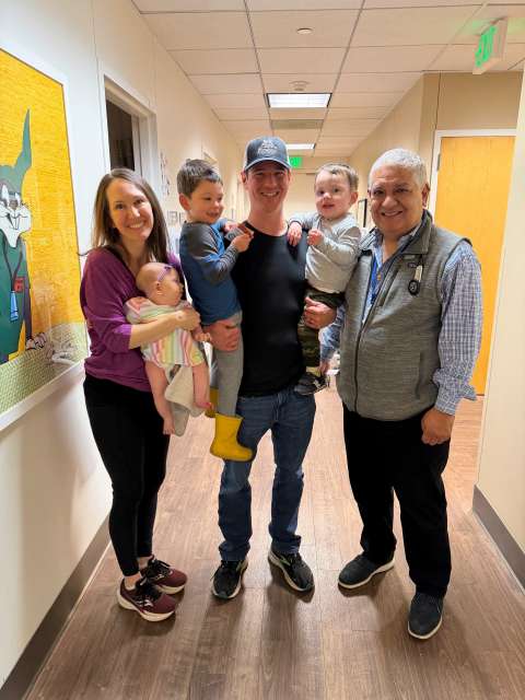 Liam and his family with his doctor.