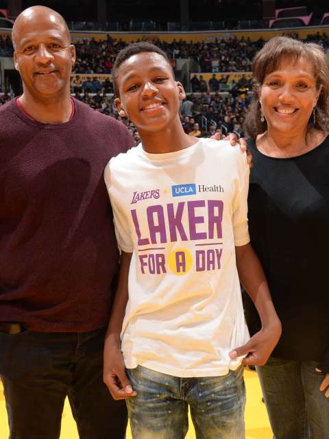 Laker For A Day Kenny Thomas with his parents.