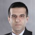 headshot of Dr. Reza Mohebi in black suit