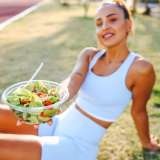 Woman with plant-based snack after workout