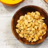 Roasted Spaghetti Squash Seeds in wooden bowl