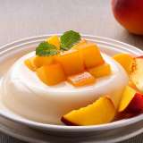 Almond Jelly with Mango on a White Plate