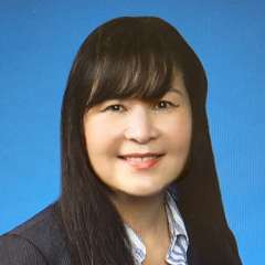 headshot of Germaine Le in black blazer