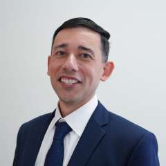 Headshot of Albert Haro in Blue Suit