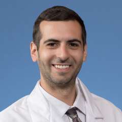 A headshot of Theo Sher, MD