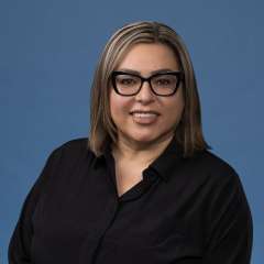 headshot of Judy Cervantes in black button down shirt