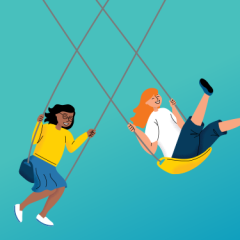 Two people laughing and swinging side by side against a blue background.