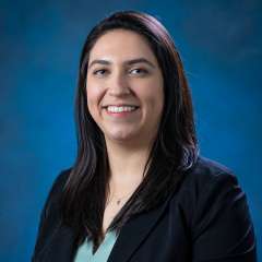 Dr. Brenda Gutierrez smiling at camera