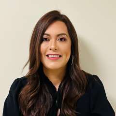 headshot of Maria Ventura in black blouse