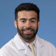 A headshot of Abraham Correa-Medina, MD